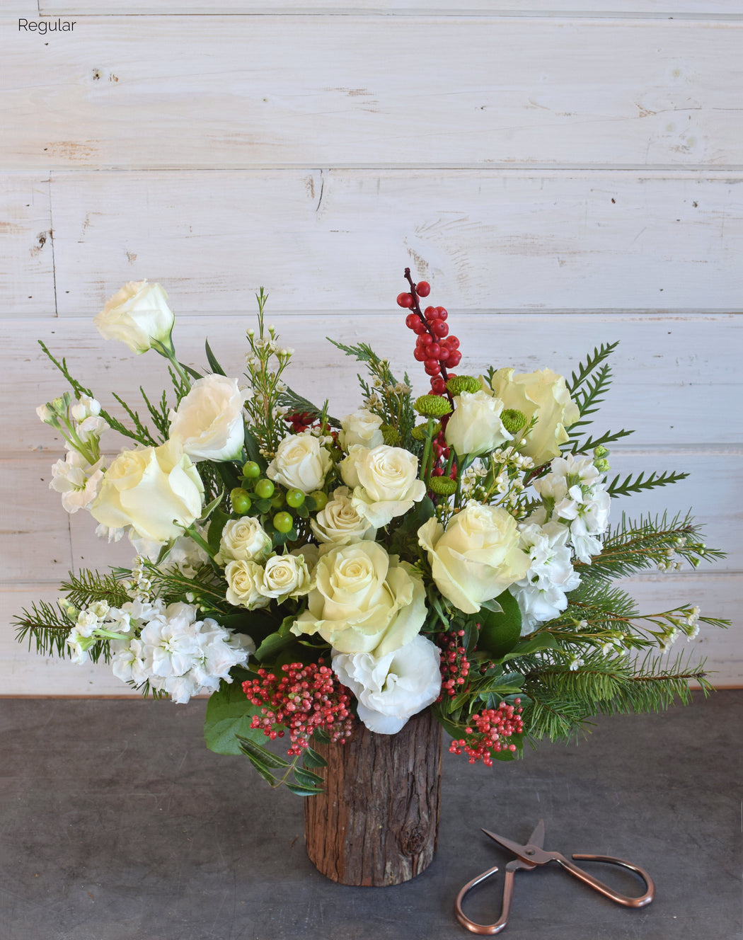 Embrace the cozy season with Flowerful's "Nice" colorway floral arrangement! Featuring snowy white roses, festive red ilex berries, lisianthus, and winter foliage like pine and eucalyptus, this design is available in two sizes. Flowerful, located in Laguna Woods, CA, proudly serves all of South Orange County with holiday-ready arrangements perfect for gifting or decorating.