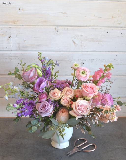 The Mombré bouquet featuring soft pink, lavender, and deep purple blooms in an ombré arrangement from Flowerful.